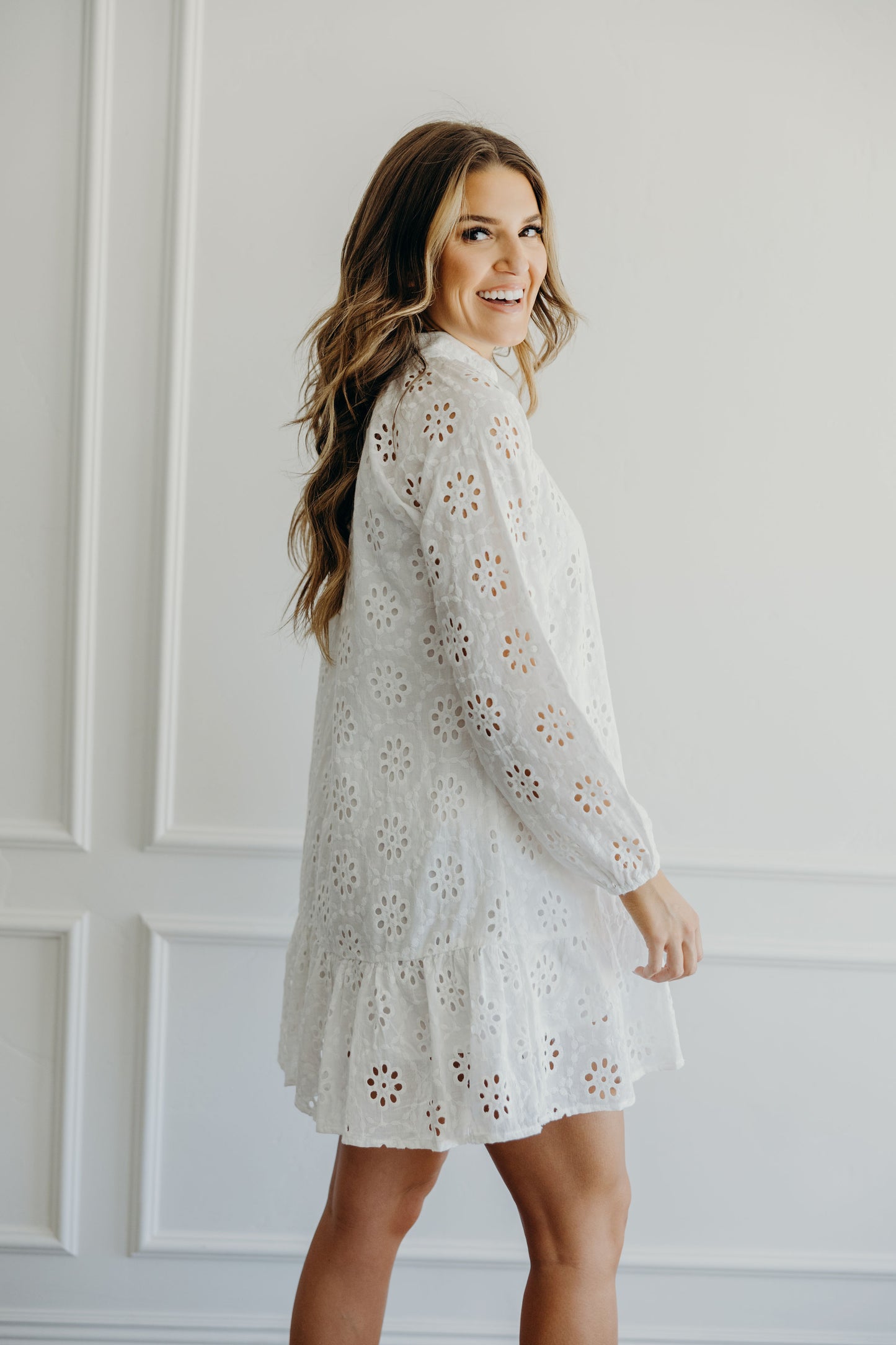 Short dress with eyelet fabric and long sleves with elastic cuffs.