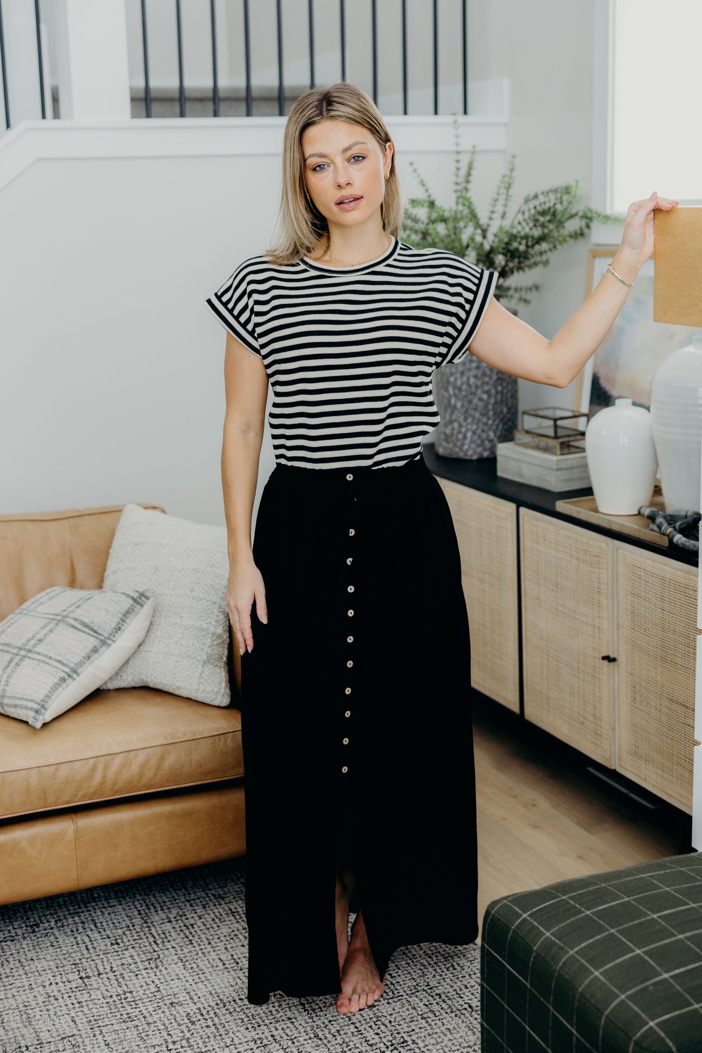 Boxy fit striped tee with short sleeves and high neckline.