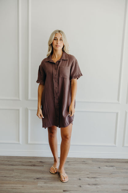Short button down dress with fringe detail on hem.