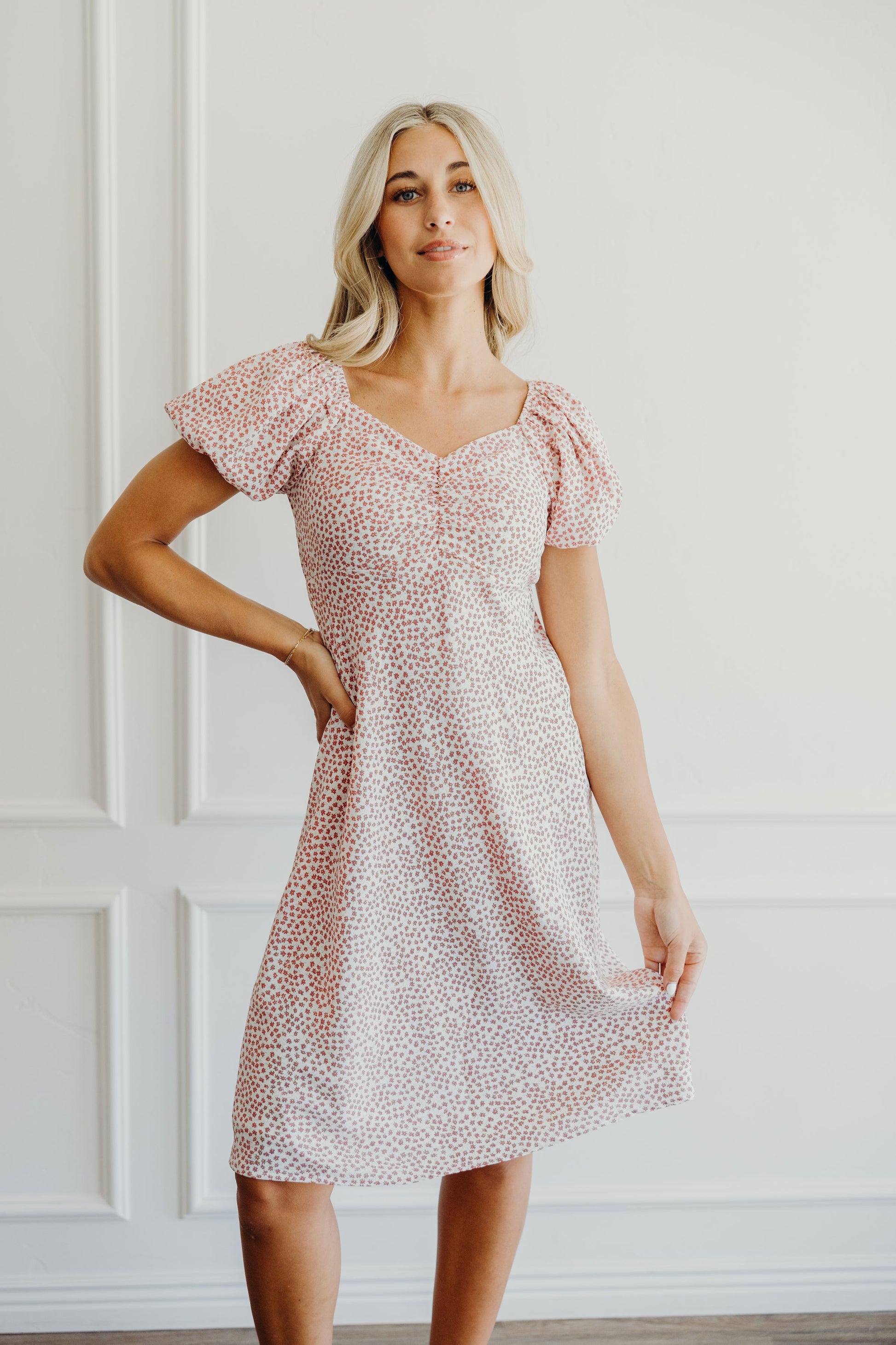 Pink floral print shift dress with sweetheart  neckline and short puff sleeves.