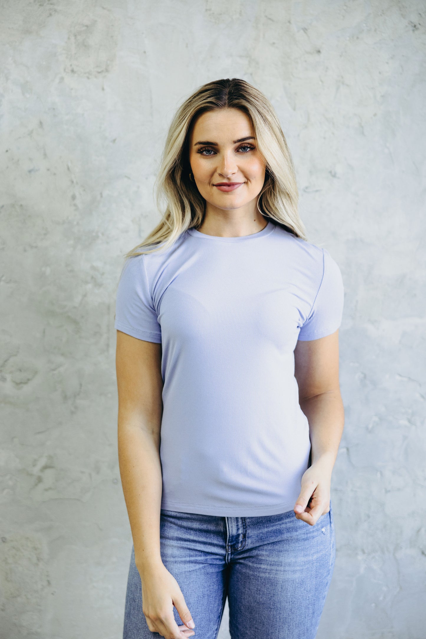 Lilac short sleeve tee with high neckline and fitted silhouette.
