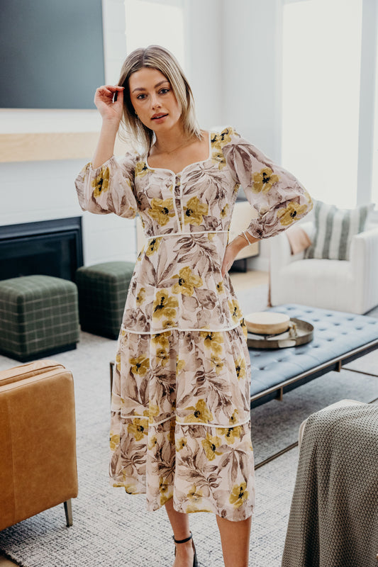 Midi Length dress with sweetheart neckline, 3/4 sleeves, tiered skirt, button detail on bust with piping detail.