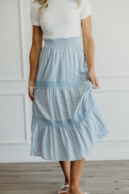 Midi length skirt with lace detail on tiers and smocked waist.