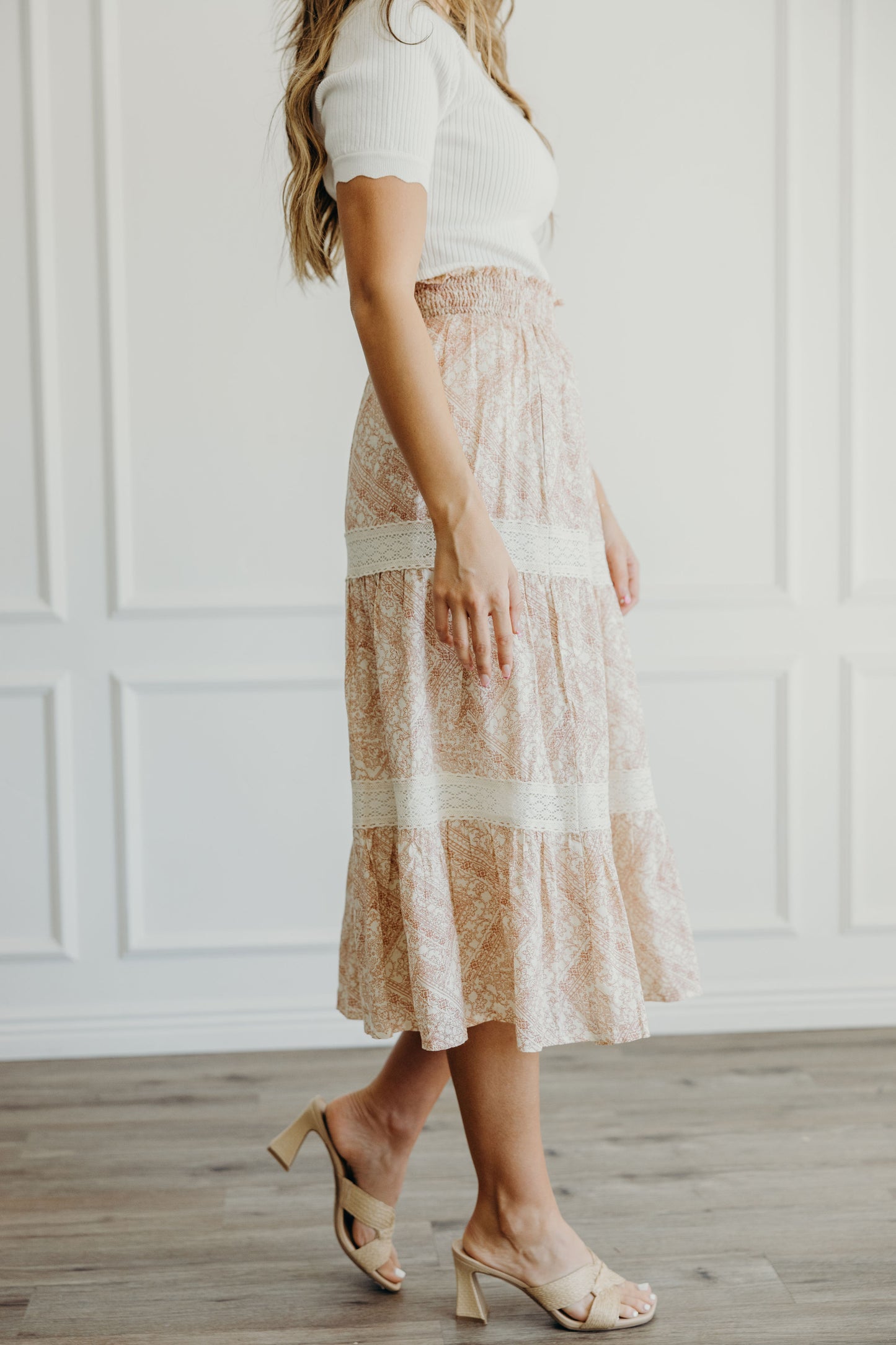 Midi length tiered skirt with lace detail and ruched waist.